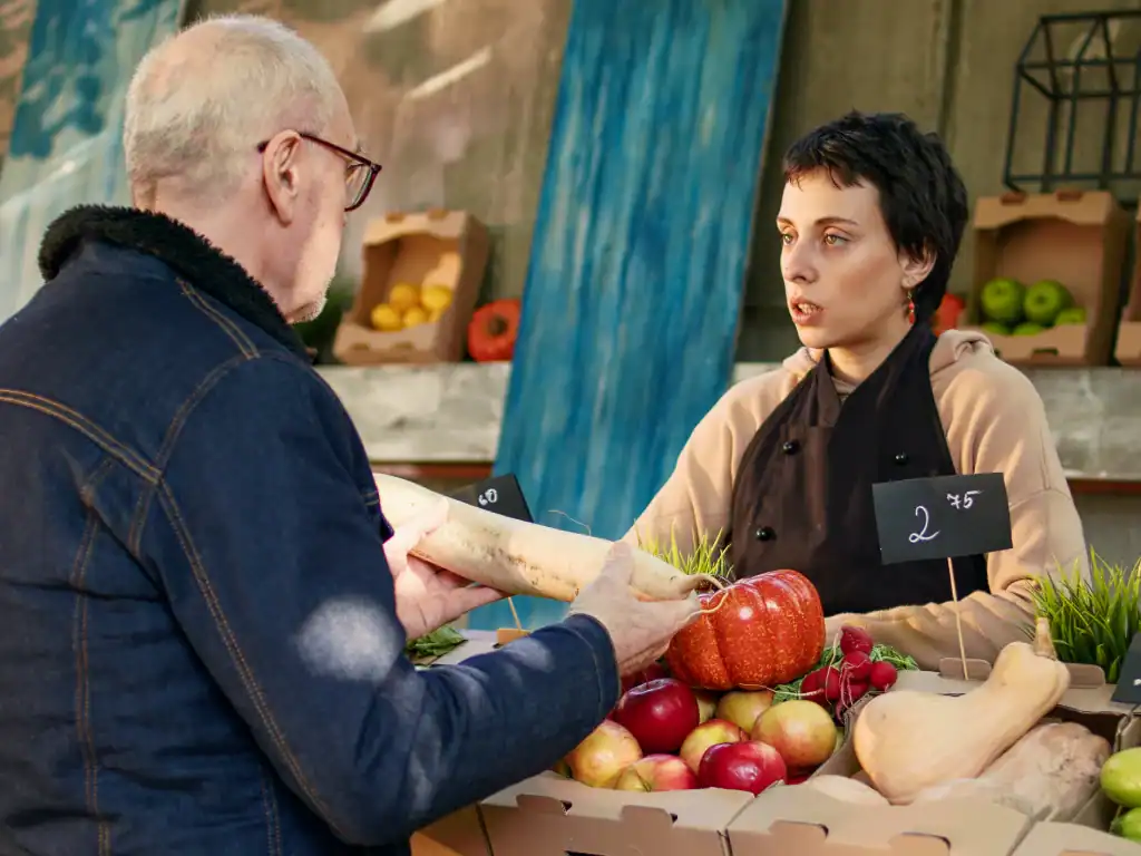 Paying by cash at a local market stall in Bolivia.