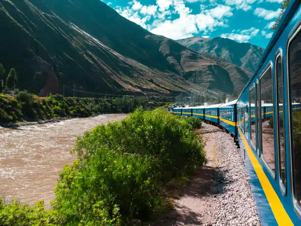 Scenic train journey through Andes landscapes near Cusco, Peru via Peru Line