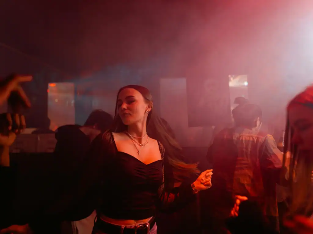 Traveller enjoying nightlife in Bolivia while staying aware in a busy nightclub environment.