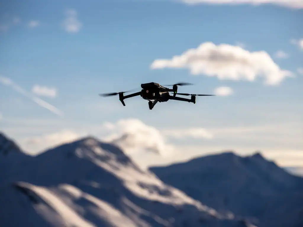 Drone flying above mountainous scenery similar to the landscapes found across Bolivia.