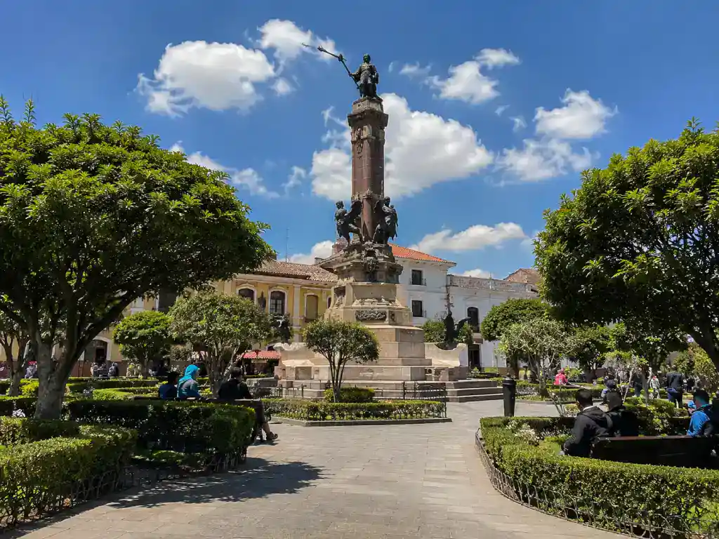 Plaza 10 de Noviembre in Potosí, Bolivia with its historic monument, gardens and colonial buildings on a sunny day.